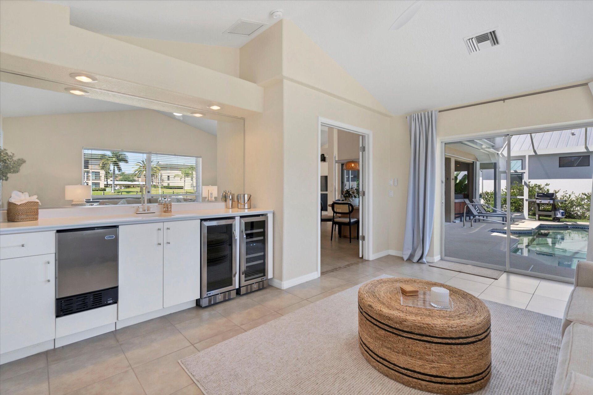 Wet bar & additonal sleeping space overlooks the canal & features a wet bar, lanai access and a queen sleeper sofa