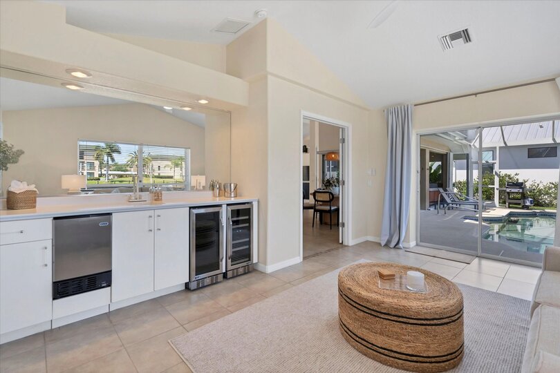 Wet bar & additonal sleeping space overlooks the canal & features a wet bar, lanai access and a queen sleeper sofa