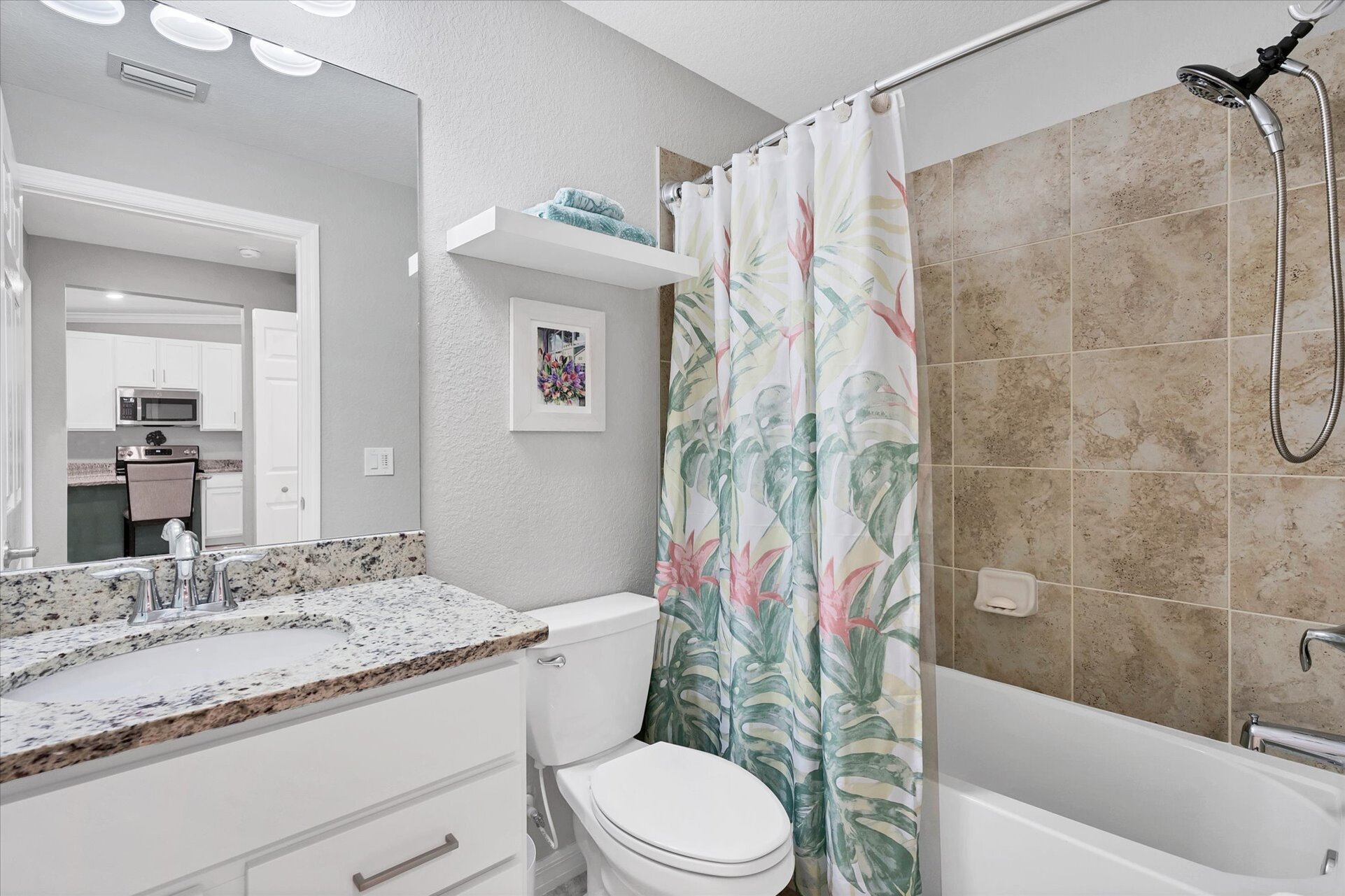 Guest bathroom has a shower/tub combo