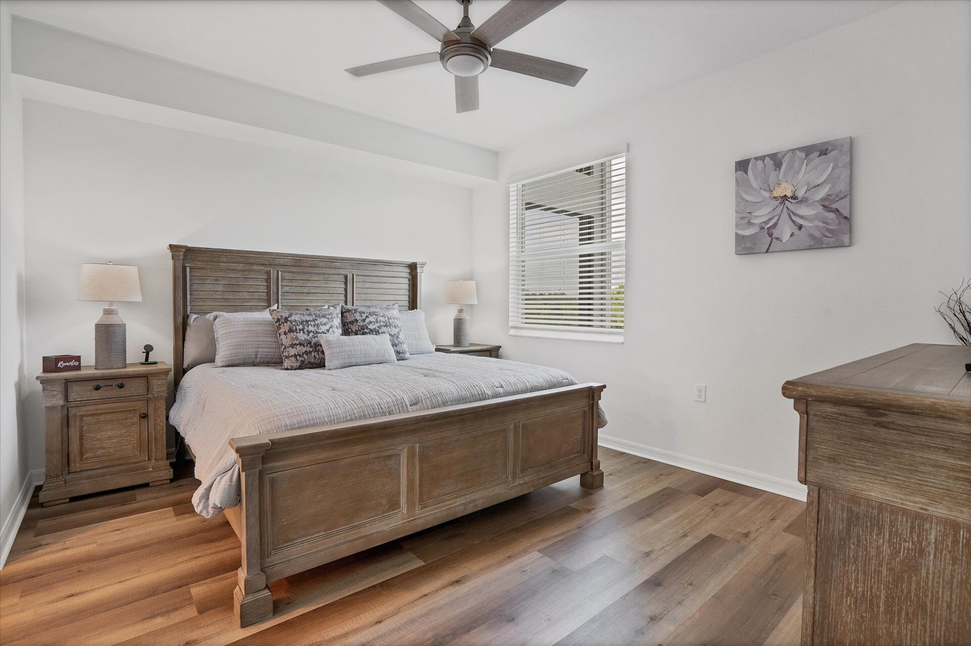 Primary bedroom with king bed, attached bathroom and 43-inch Smart TV