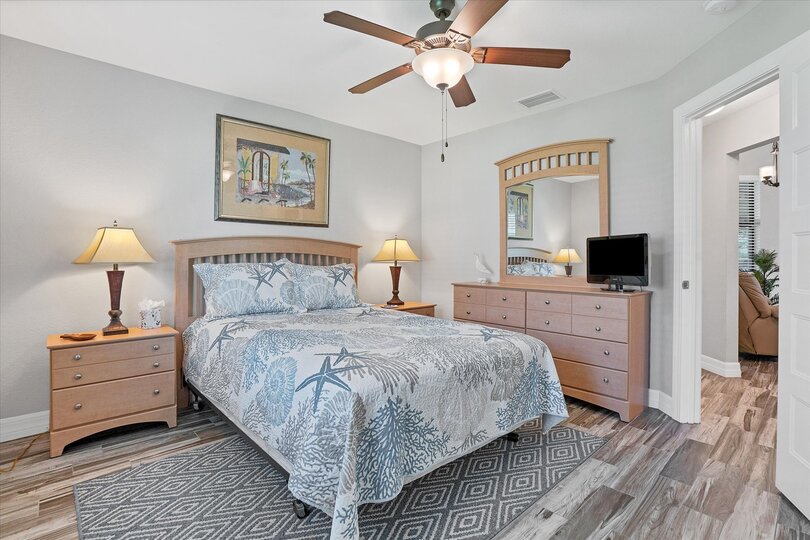 Guest bedroom 1 with queen bed and 24-inch Smart TV
