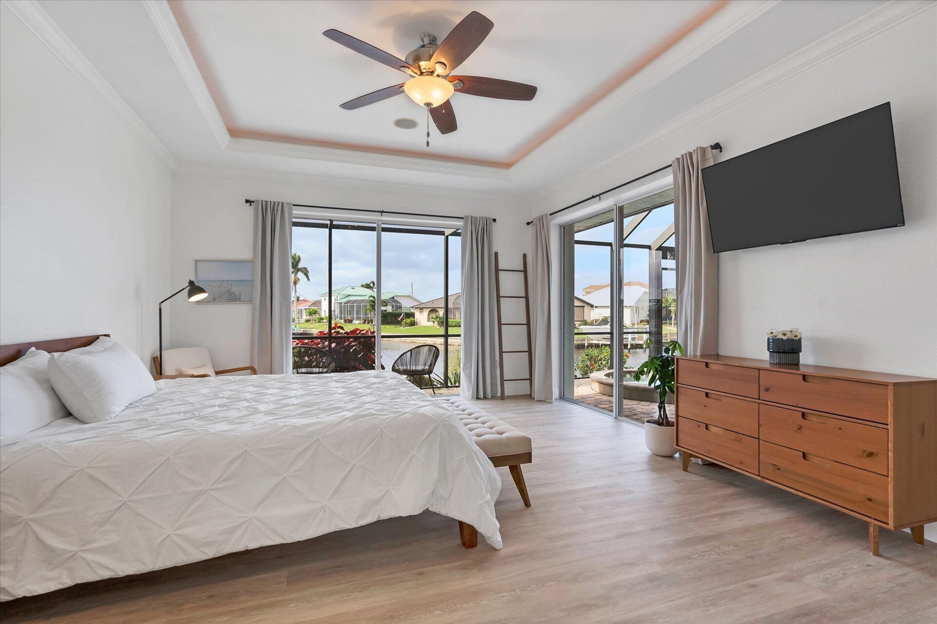 Primary Bedroom features king bed, ensuite, and lanai access