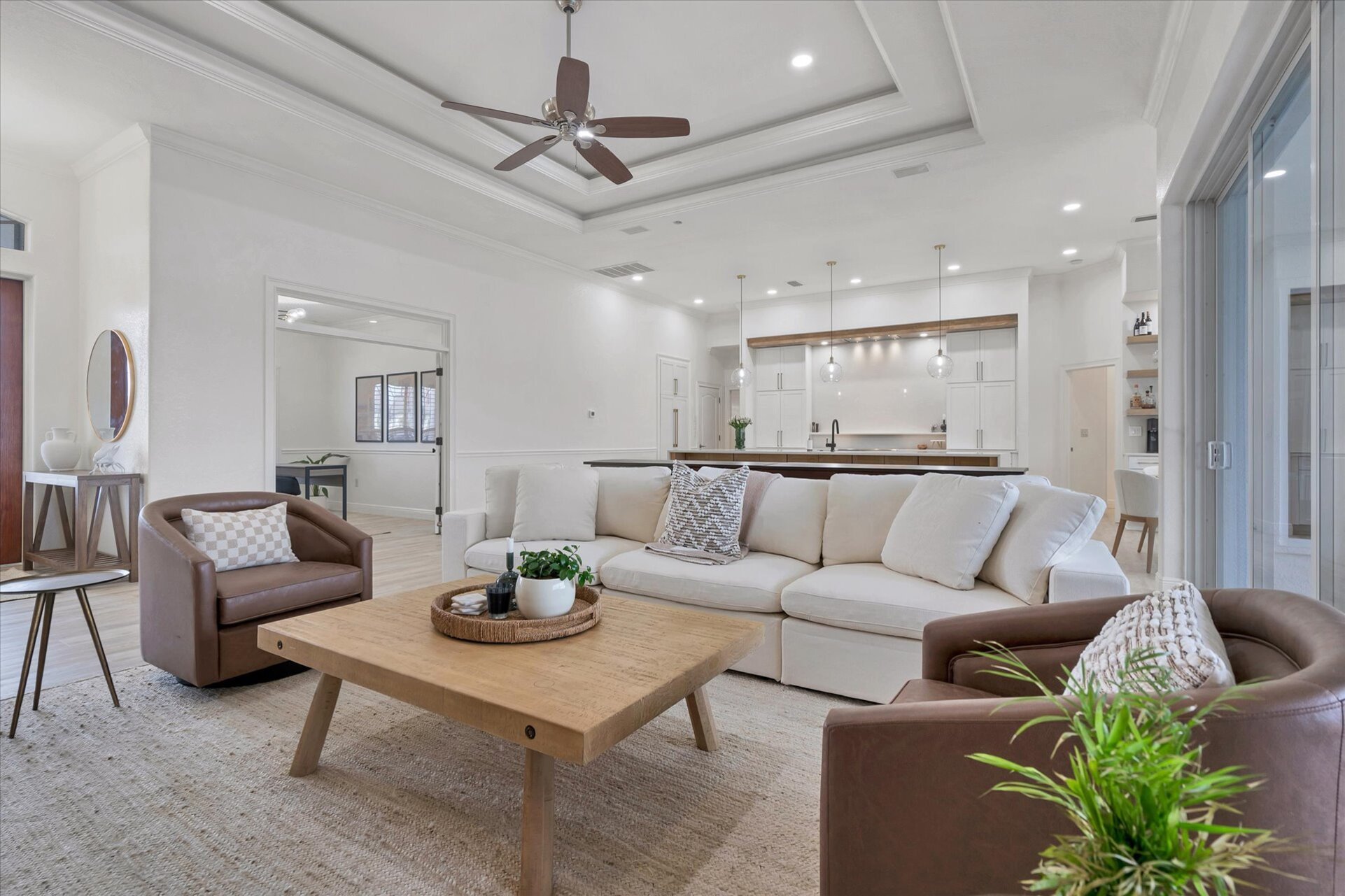 Beautiful open living area with ample seating, 65-inch Smart TV & dining table that converts to a tavern shuffleboard table
