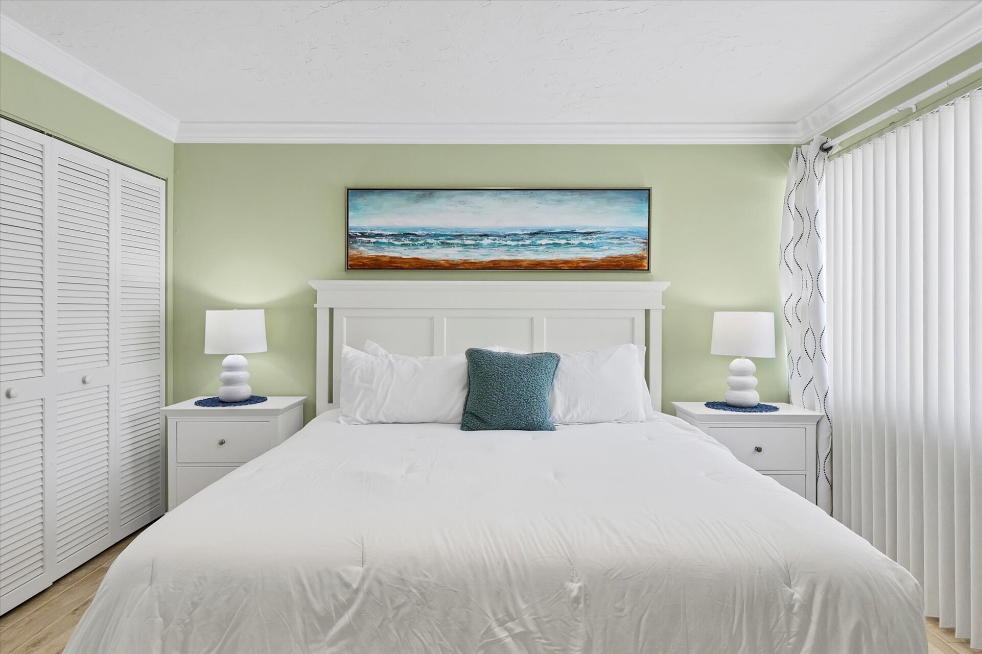 Primary bedroom featuring king bed and 32-inch Smart TV