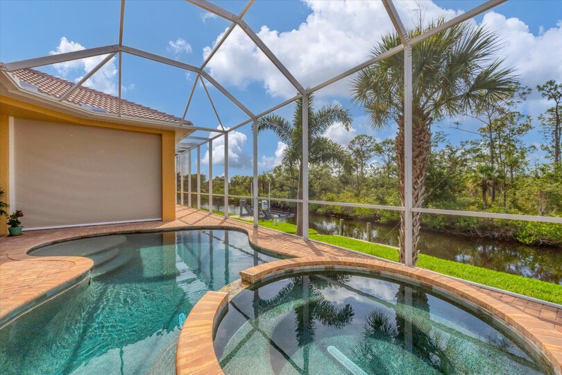 Sparkling private saltwater pool & spa overlooking water. Lanai features remote controlled privacy screens. Pool size is 17'L x 10'W x 6'D