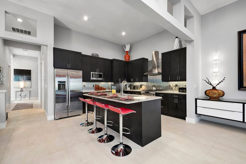 The spacious kitchen features stainless steel appliances