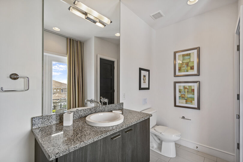A half bathroom located on the third floor