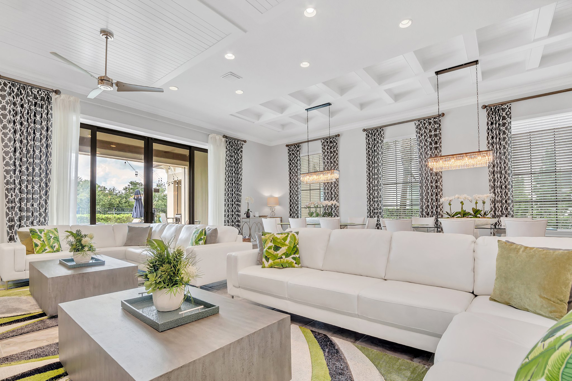 Spacious and comfortable living area with a beautiful view to the pool area