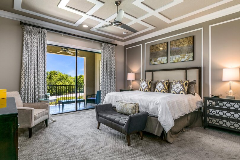 A master suite located on the second floor with king size bed, en-suite bathroom, and access to the balcony