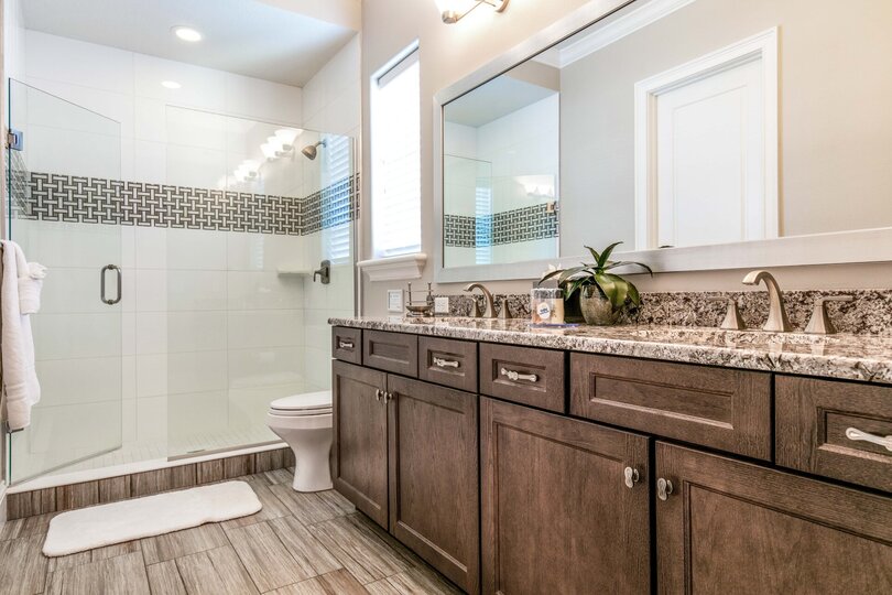 En-suite bathroom with dual vanity and a walk-in shower