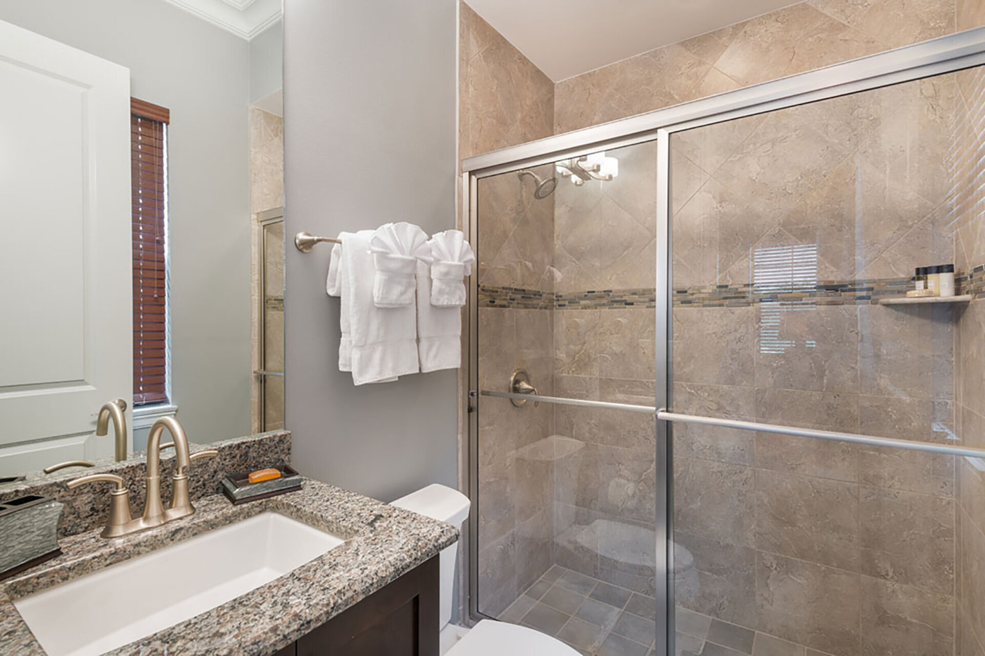 The master en-suite bathroom features a glass door walk-in shower