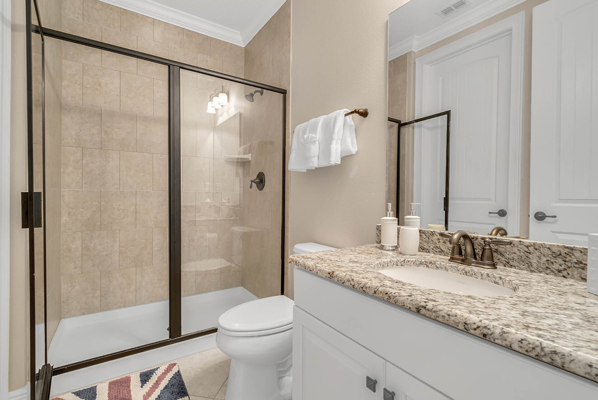 The ensuite bathroom has a walk in shower and plenty of room to get ready