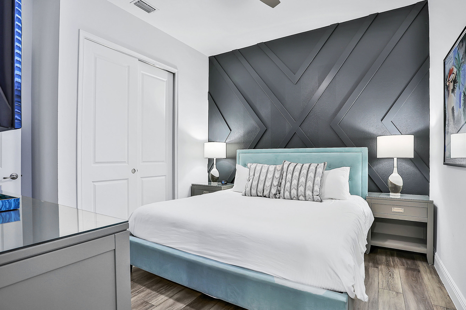 This bedroom features a king-sized bed and en suite bathroom