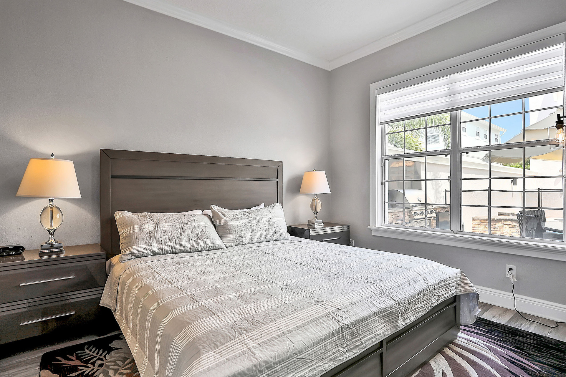 This master suite on the ground floor features a king-sized bed