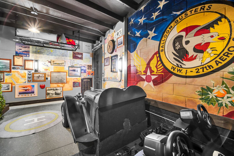 A game room with virtual reality games as well as simulators.