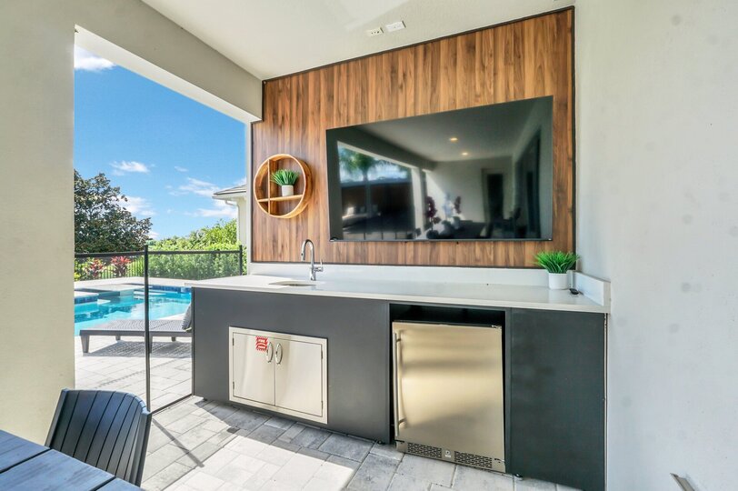 Enjoy a movie or two at the pool and patio area. With comfortable seating and a large screen set up for outdoor viewing, you can relax by the water while watching your favorite films