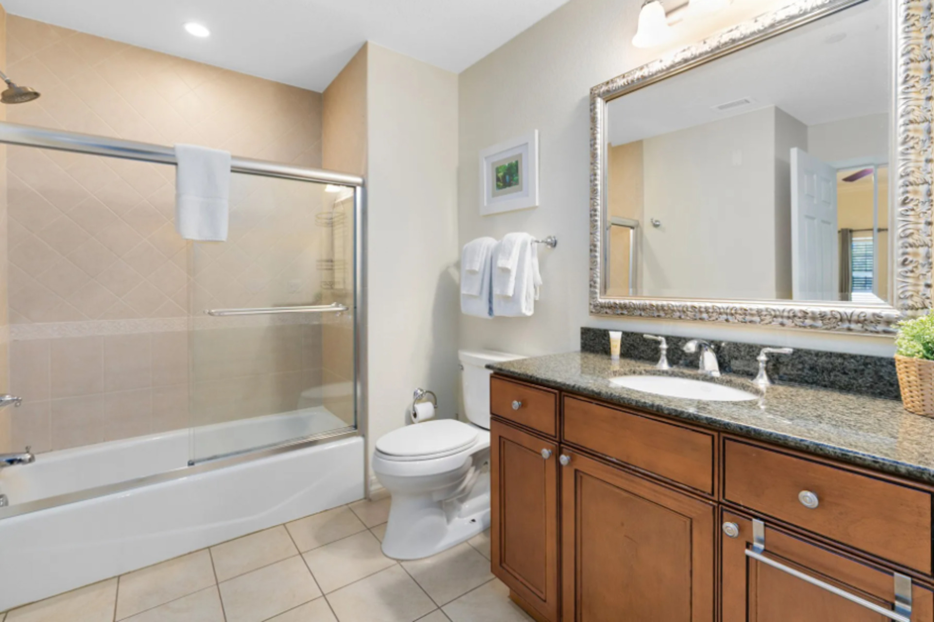 Enjoy the convenience of an en-suite bathroom featuring a walk-in shower for a refreshing start to your day