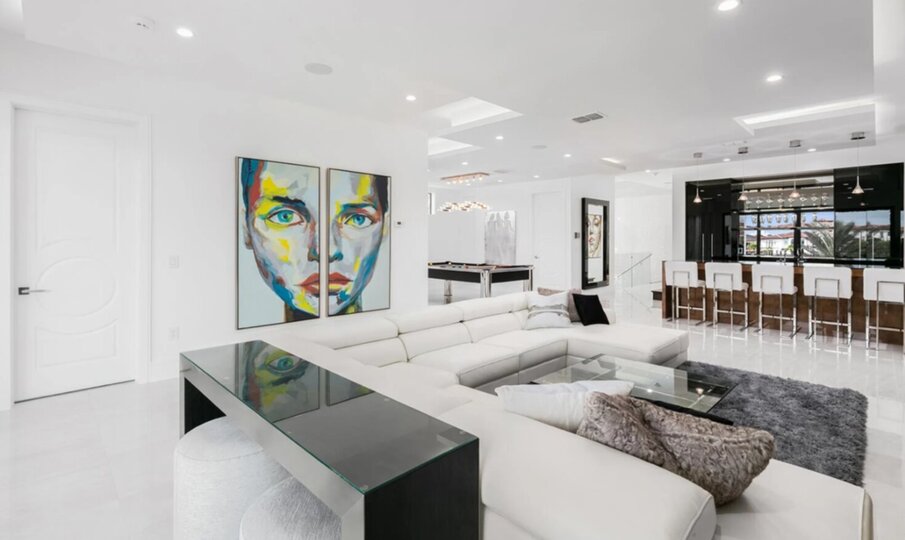 Second Floor Gathering Room with Modern Leather Sectional, Wet Bar, and Billiards