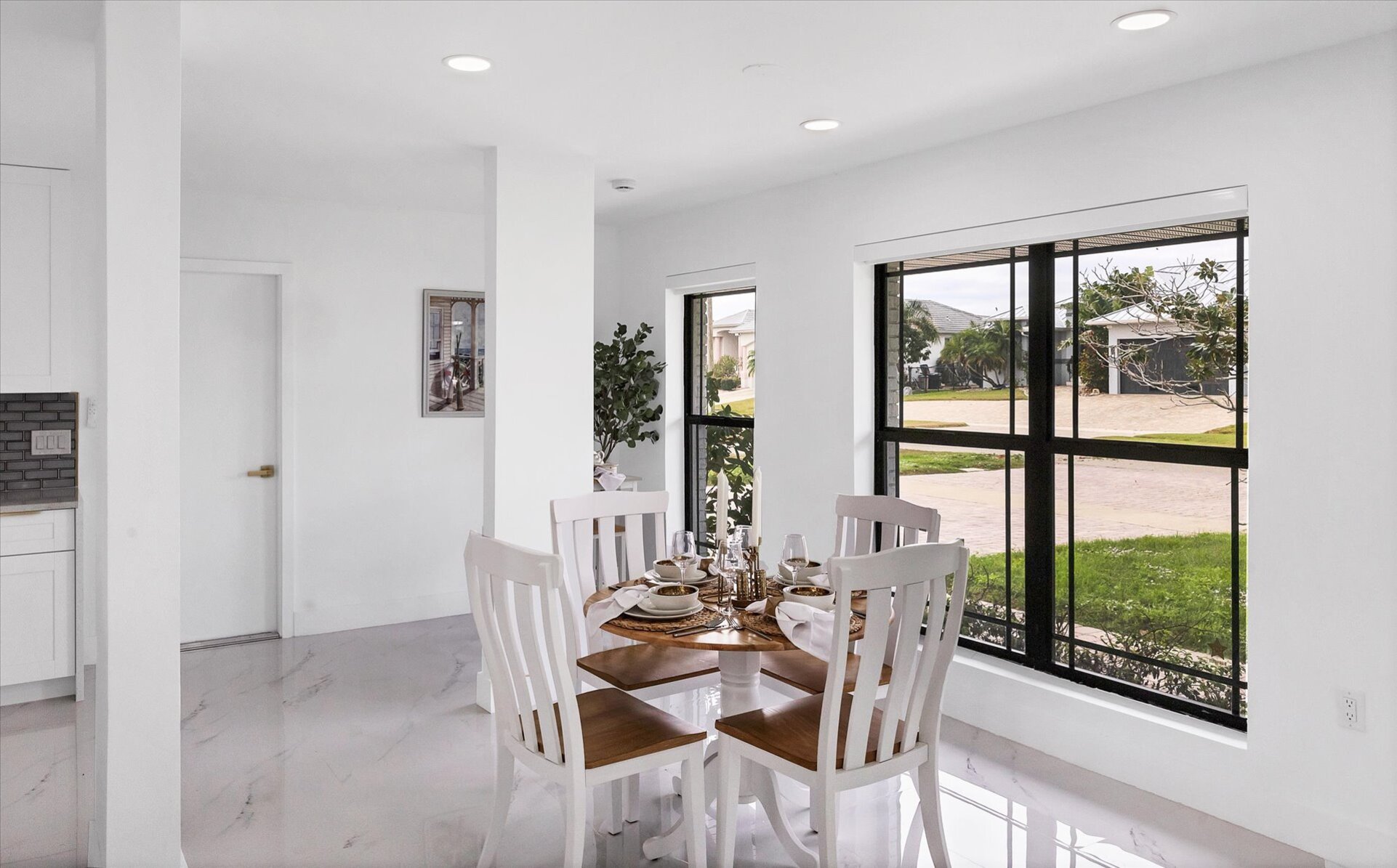 Dining area. Dining table seats 4 with additional seating at kitchen island, bar top table, and kitchen nook area