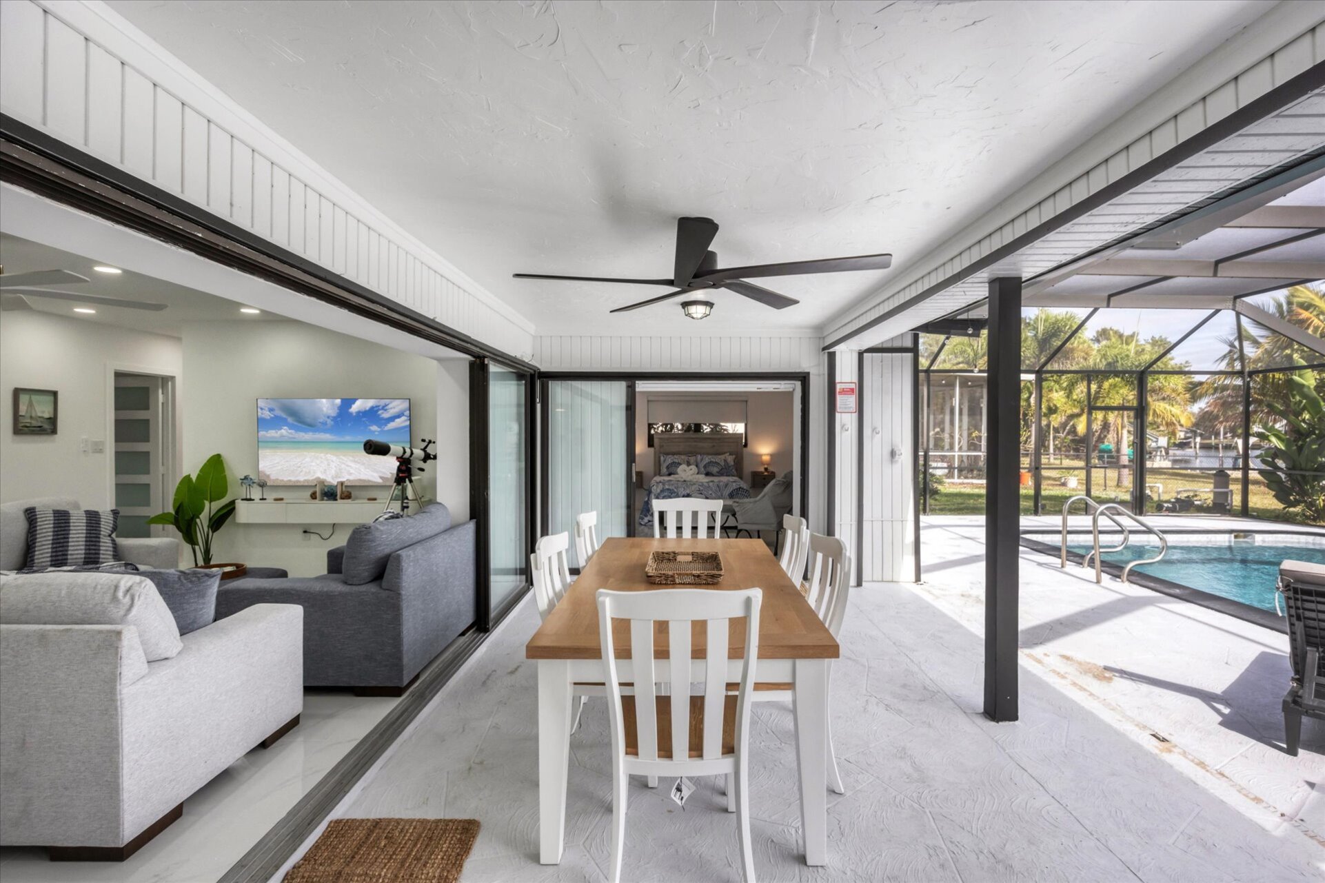 Extra large lanai overlooking the canal. Includes sparkling pool, relaxing hot tub, al fresco dining and more. Pool size: 14' x 28' x 6'