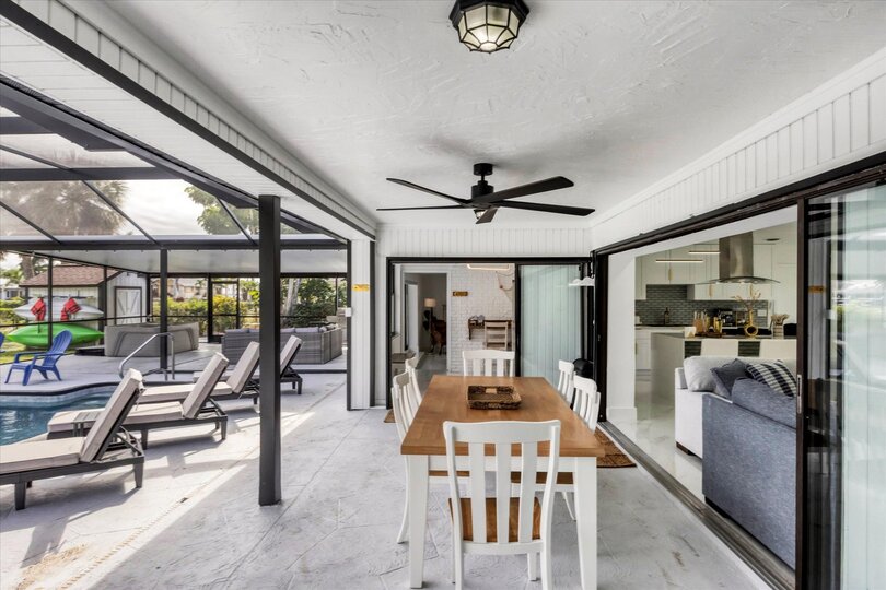 Extra large lanai overlooking the canal. Includes sparkling pool, relaxing hot tub, al fresco dining and more. Pool size: 14' x 28' x 6'