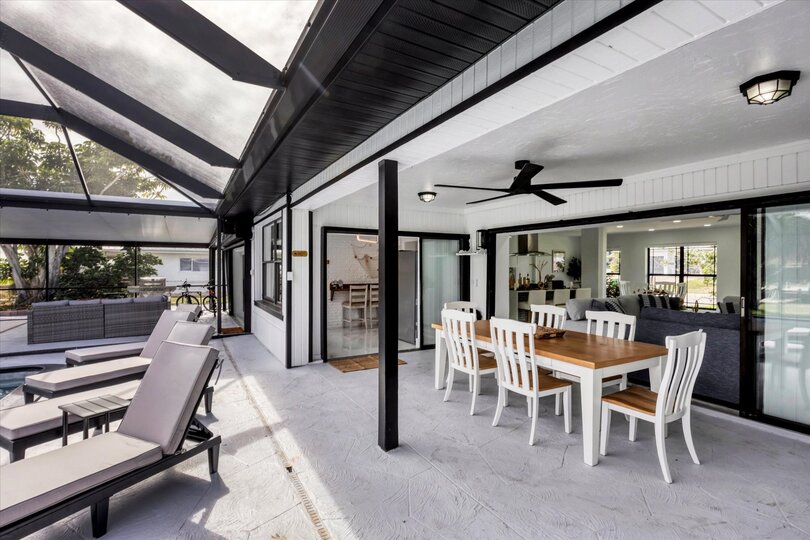 Extra large lanai overlooking the canal. Includes sparkling pool, relaxing hot tub, al fresco dining and more. Pool size: 14' x 28' x 6'