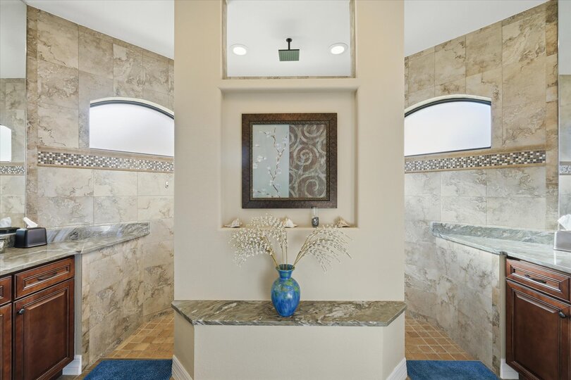 Primary en suite with large walk-in shower and double vanities