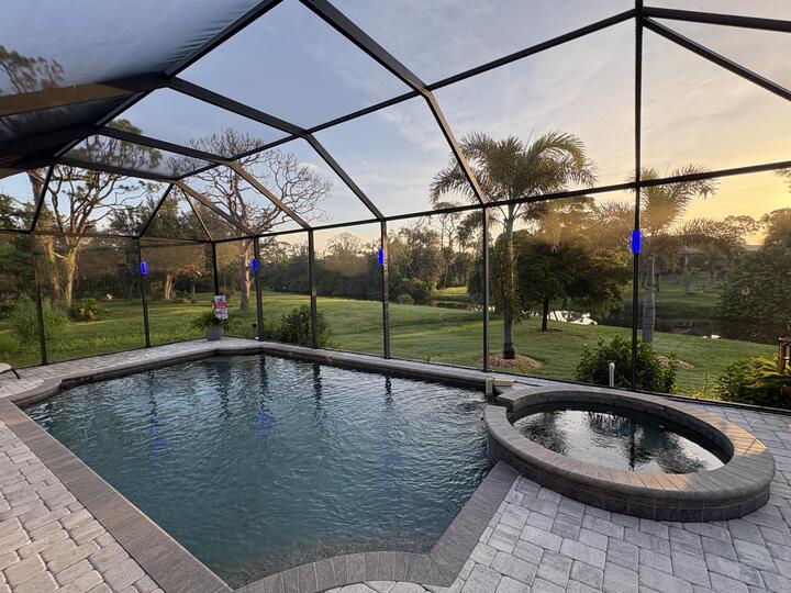 Sparkling pool & spa overlooking canal. Pool size: 22' x 14' x 6'. Spa seats 6