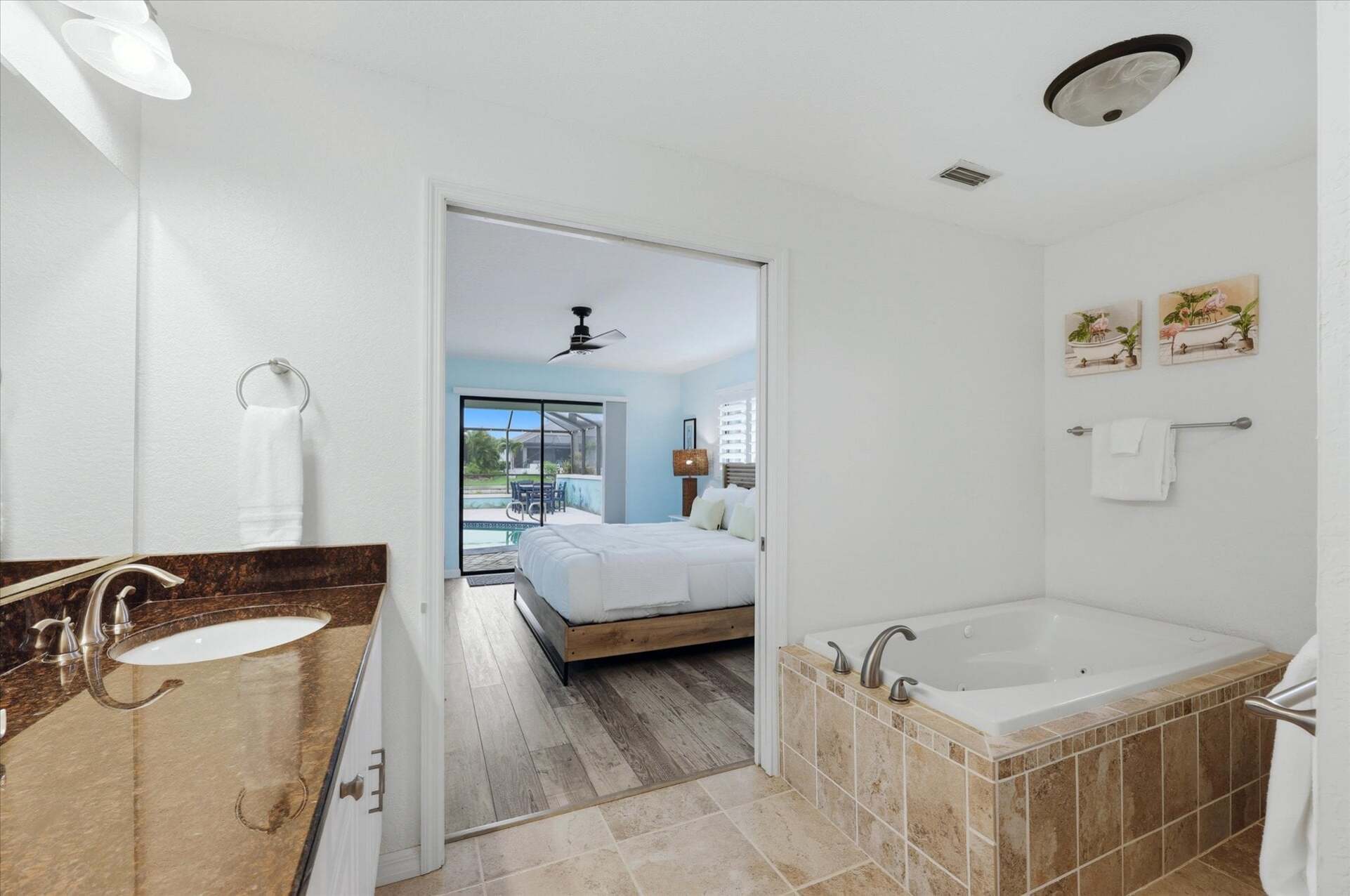 Primary bedroom attached bathroom with walk-in shower, soaking tub, and double vanities