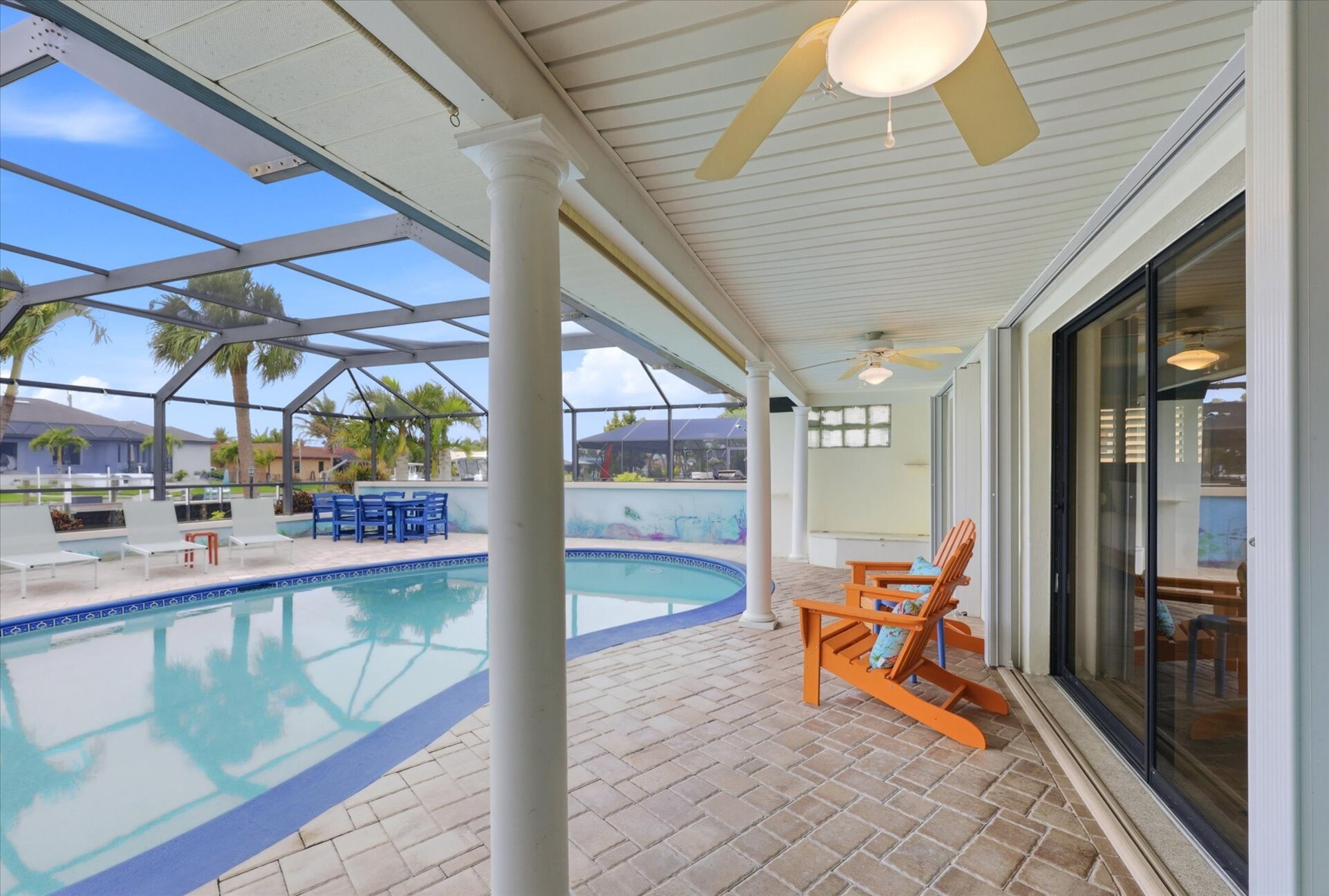 Large lanai with private sparkling pool is perfect for entertaining. Features sun loungers, dining table that seats 6, and 43-inch Smart TV