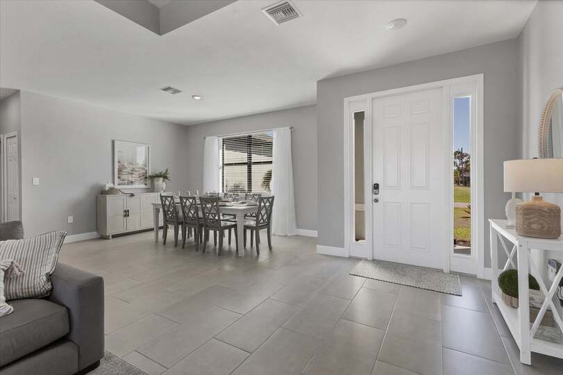 Beautiful, bright, open living area. Dining table seats 8