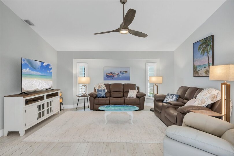 Bright, open living space with 65" TV