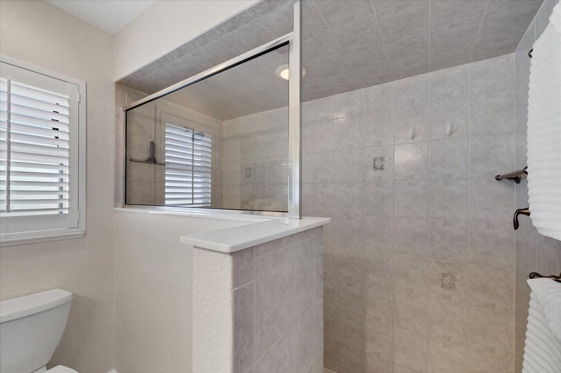 Primary bedroom's attached bathroom with walk-in shower