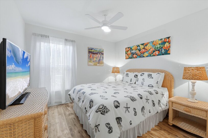 Guest bedrom with queen bed and 55-inch Smart TV
