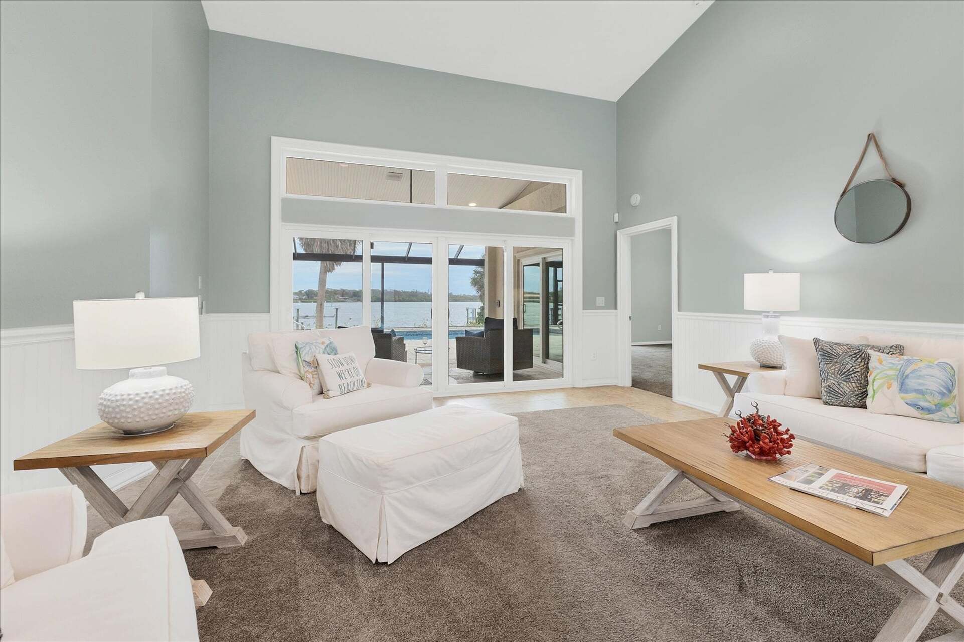 Living room overlooking the sparkling pool
