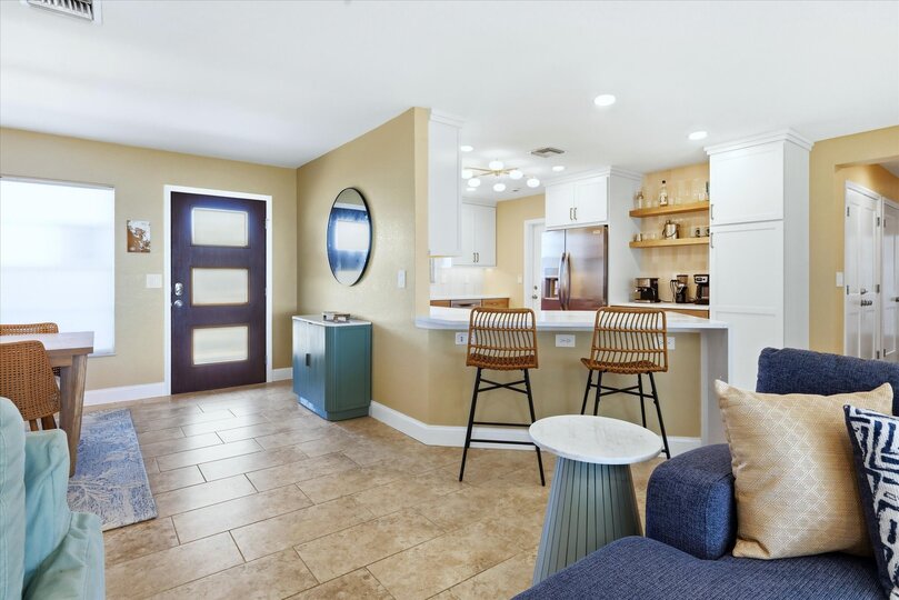 Beautiful open living space overlooking the sparkling pool with an amazing view of the Peace River