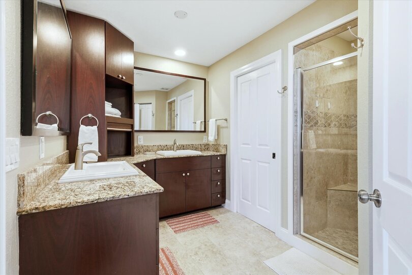 Upstairs bathroom with walk-in shower and double vanities