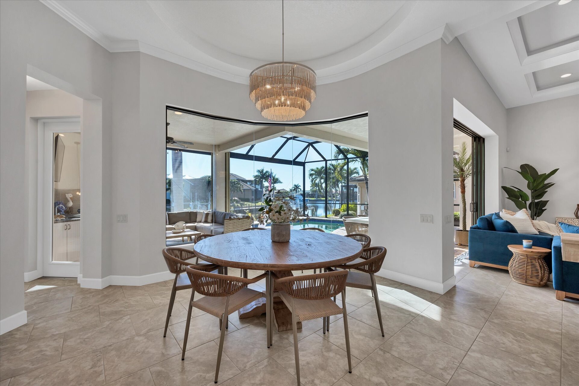 Dining area overlooking pool and canal. Dining table seats 8