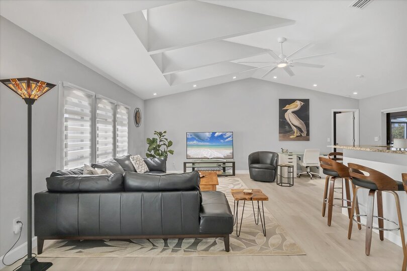 Large, Open, and Bright Living Area with 65" Smart TV