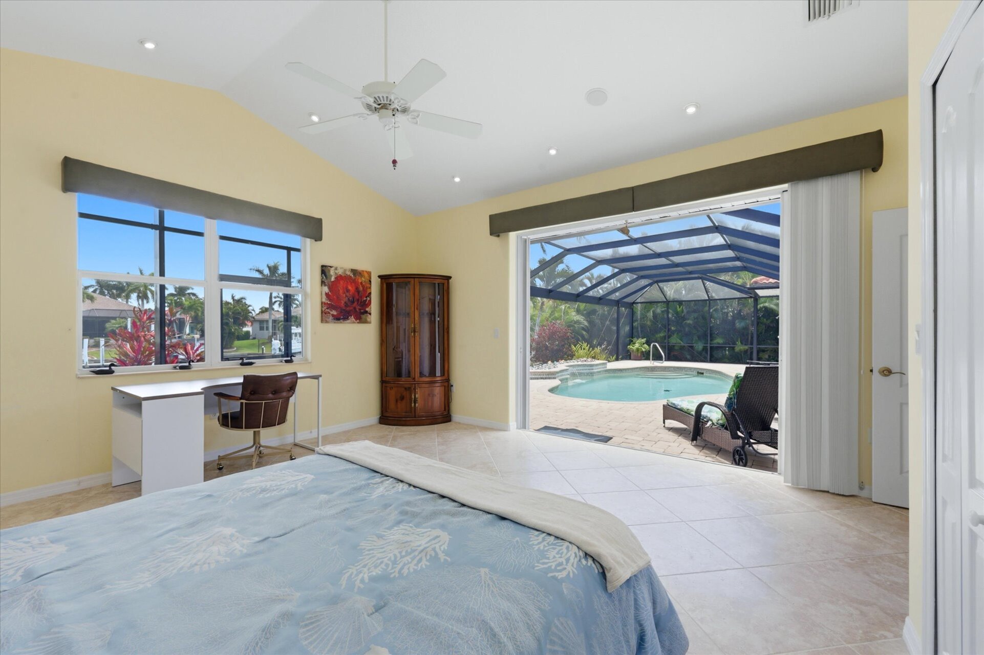 Bedroom 2 with queen Murphy bed, lanai access, and desk & chair
